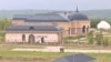 Kazakhstan – two men guard the villa and the territory of the Ushkonyr plateau, Ush Konyr zhailau in Almaty region. June 23, 2022