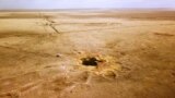 Ядролық сынақ жайлы ('Like An Undeclared War': Russia's Toxic Test Sites In Kazakhstan) деректі фильмнен алынған скриншот. 