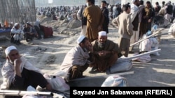 Afghanistan- afghan labors wait for customer on a road side in Kabul July, 04, 2011.